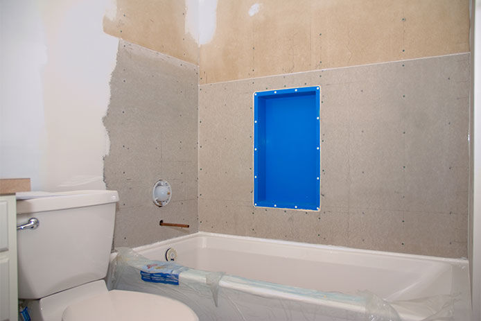 Exposed backer board to bathroom shower