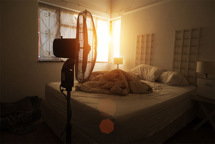 Fan next to bed