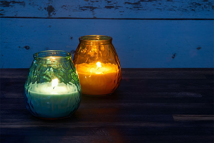 Two lit citronella candles