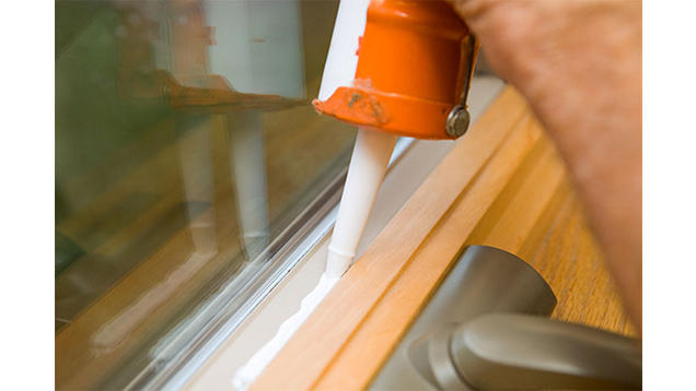 Using caulk to seal a drafty window
