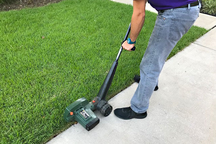 Man using a lawn edger