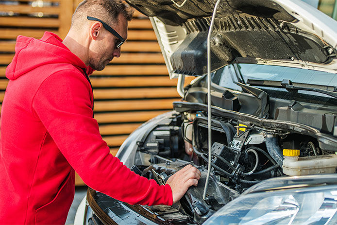 A man inspecting an engine