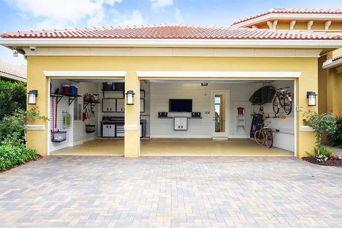 An open garage door looking into an organized garage