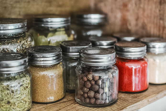 glass jars of seasonings and spices