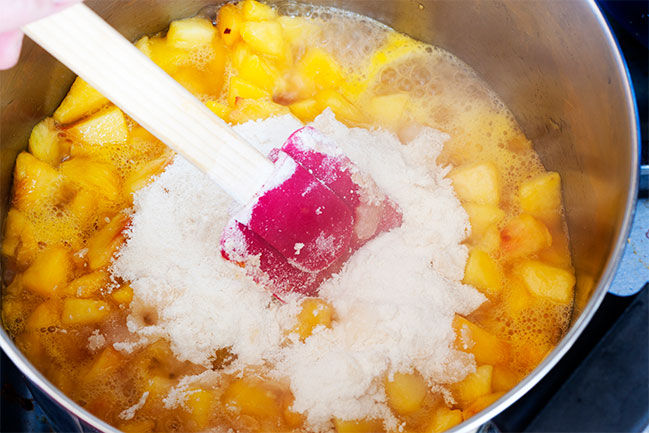 Fruit and syrup in a pot on the stove