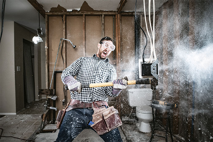 Contractor Man Doing Home Improvement and Demolition