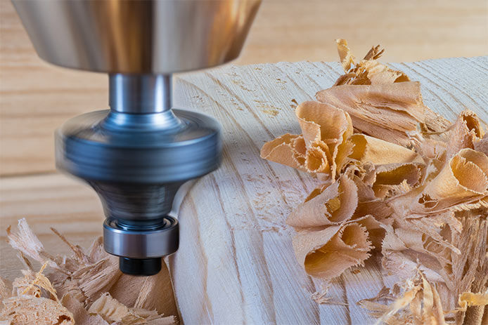 A router making light cuts on a peice of wood