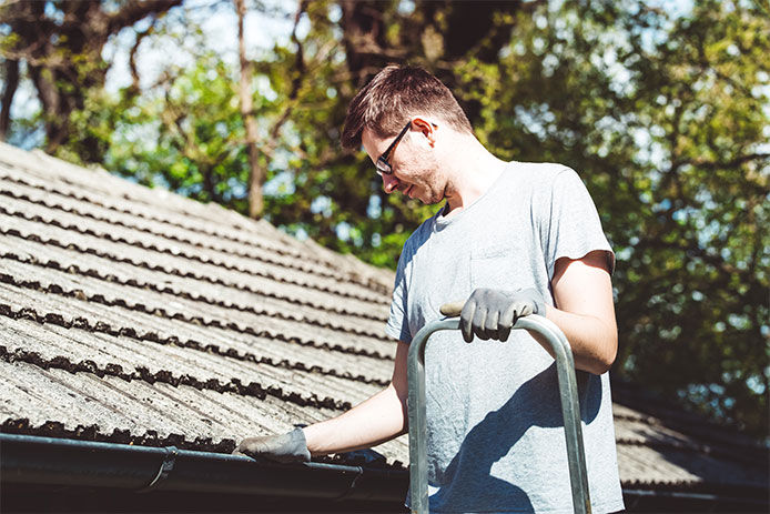 Man inspecting roof