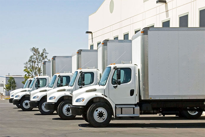 Moving box trucks all lined up in a row