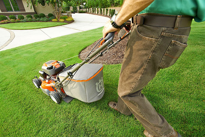 Man mowing the lawn, close-up