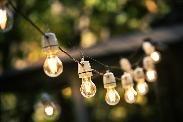 Patio lights strung and turned on, close-up