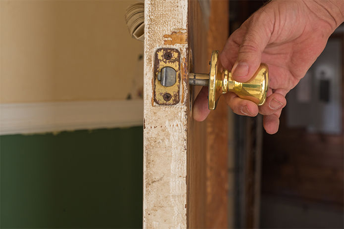 Removing the old doorknob from a door