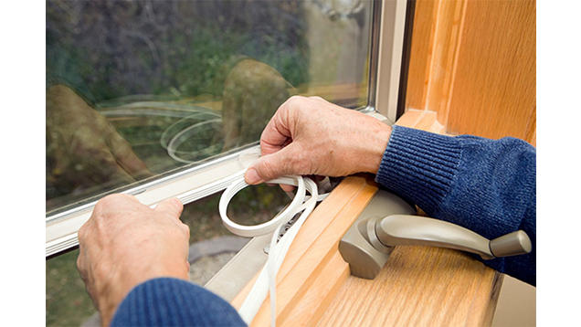 Applying weatherstripping to a window