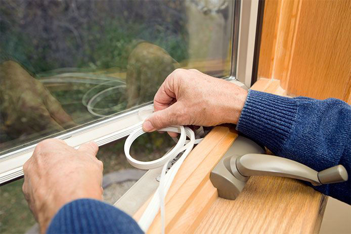 Applying rubber weatherstripping to a window