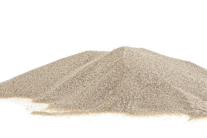 A small pile of sand on a white background