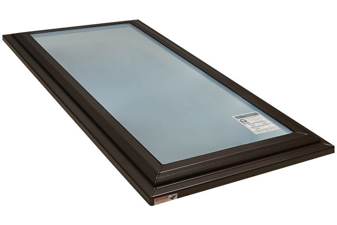 An isolated image of a skylight with a brown frame
