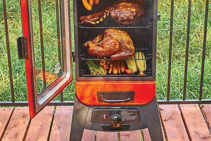 Fried turkey and vegetables in smoker