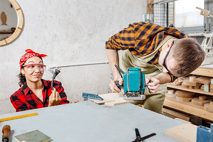 A woman unlpugging a router