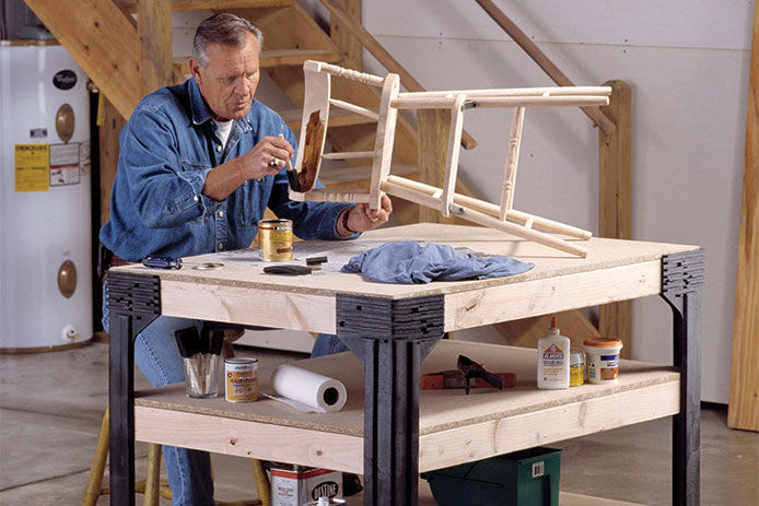 A man making a wooden chair