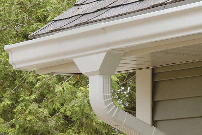 Showing the downspout of a gutter on the corner of a roof