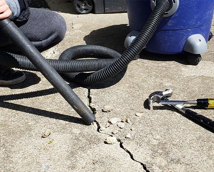Vacuuming concrete crack