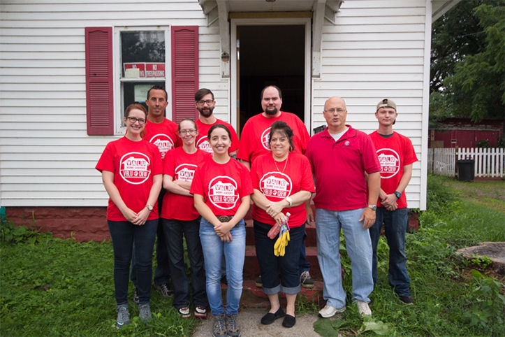 Valu Crew in front of Habitat for Humanity project home