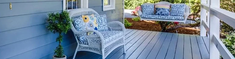 Image of the front porch of a house with outdoor funiture