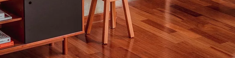 Image of wood flooring being the focus with furniture in the room