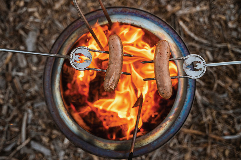Solo Stove accessories hot dog forks over a fire 