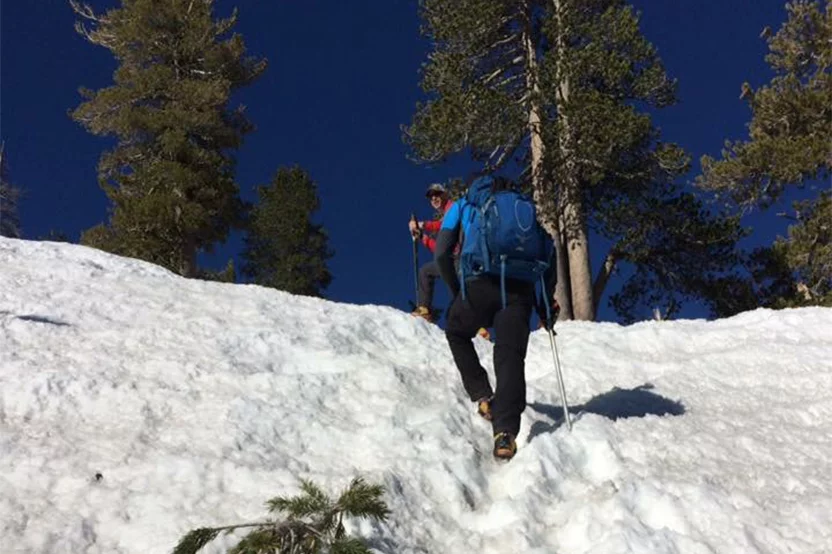 people hiking in the snow