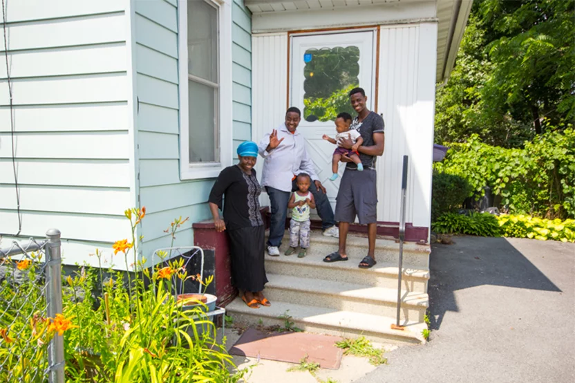 Family photo in front of home