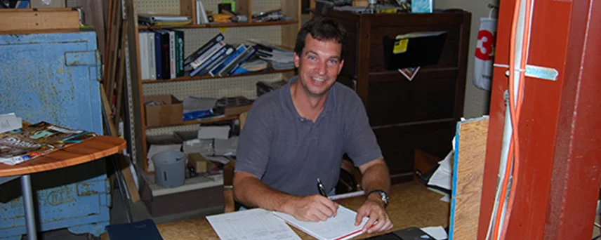 Photo of Arco Employee Working at Desk