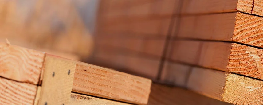 Lumber Stacked Neatly In Piles