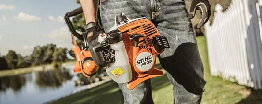 Person holding a Stihl weed wacker