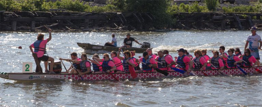 Valu crew paddling in the dragon boat