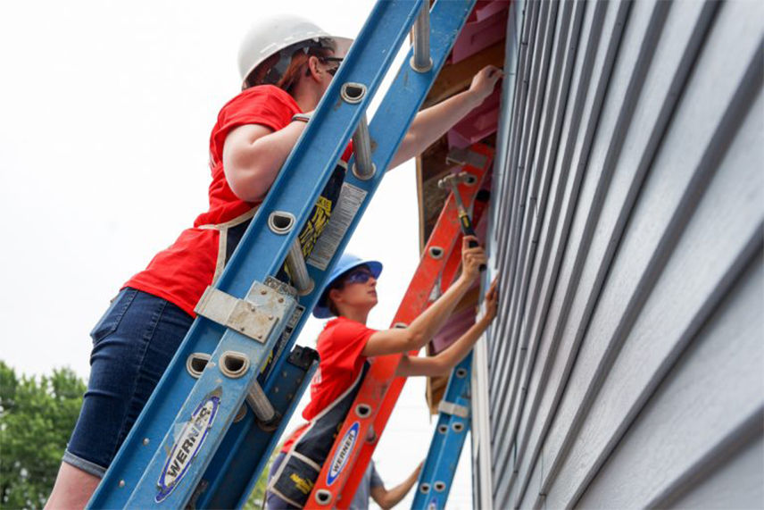  Women from the Valu Home Centers team working together to help build the 300th Habitat for Humanity house in Buffalo, NY 