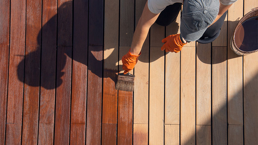 Applying stain with a paintbrush