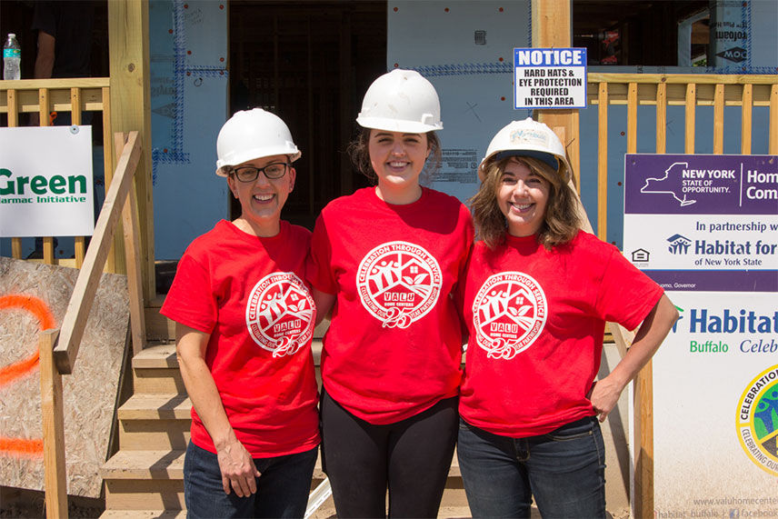 Valu crew posing infront of unfinished house