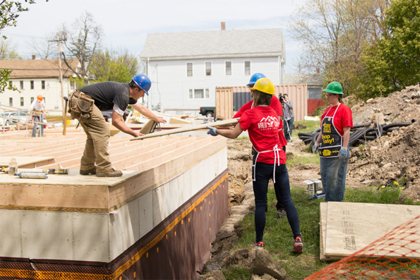 Valu crew members moving lumber