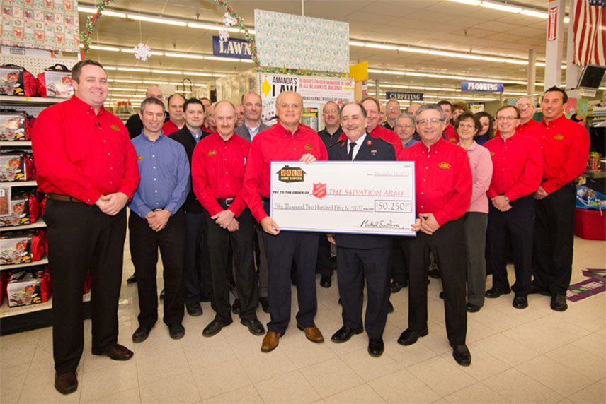 Valu crew presenting check to Salvation Army