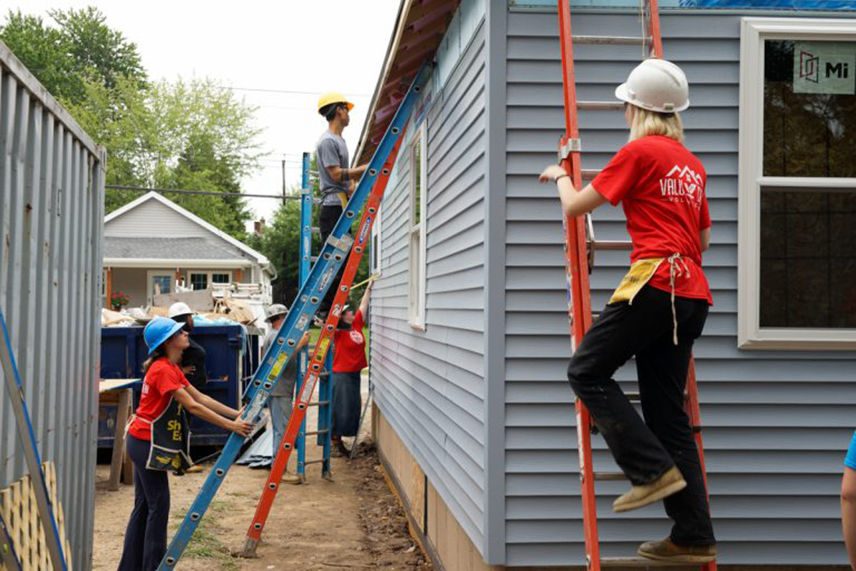 Women from the Valu Home Centers finishing a home