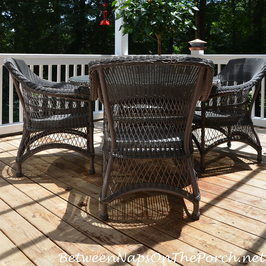 Close-up on the patchy stain on wood deck after powerwashing