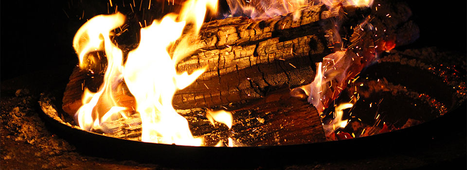 A lit firepit at night