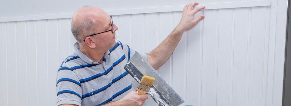 Guy installing paneling
