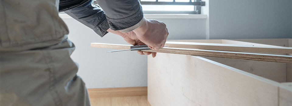 A man building shelves