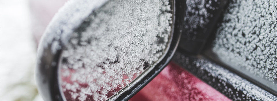 Frost covered car mirror