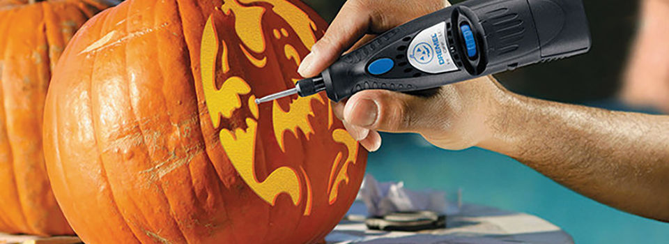 Carving a pumpkin with a dremel
