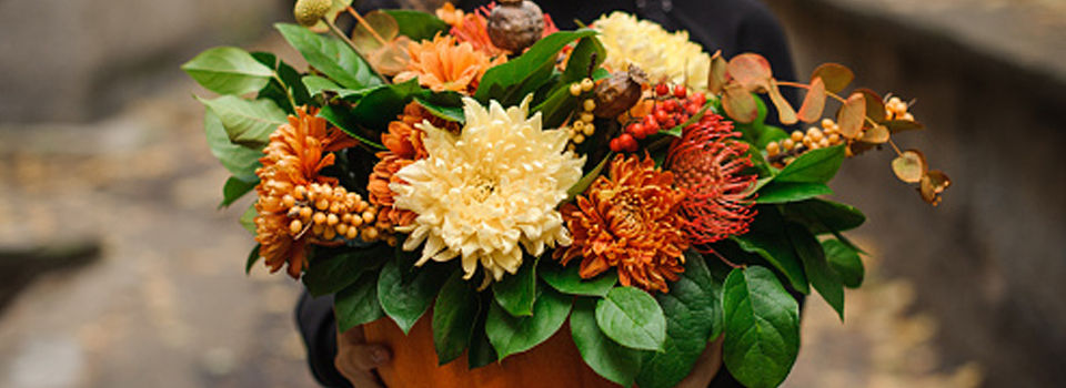 Burnt orange, cream, and maroon flower bouquet