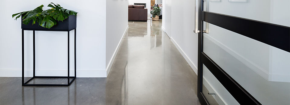 Contemporary home entry hall with polished concrete floors