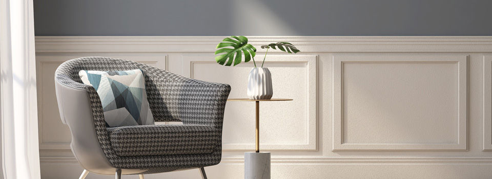 painted wainscoting in room with a gray chair